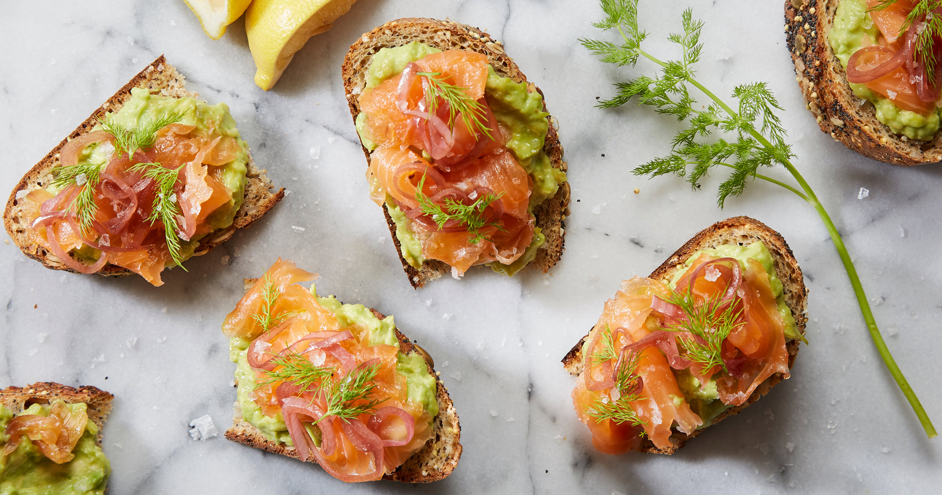 Cured Gravlax, Salmon, cured food. Sliced Salmon, dill, pickled red onion,guacamole, lemon, whole grain bread  photo by Chris Kessler Photography.  Chris Kessler is a freelance Photographer based in Milwaukee Wisconsin. Specializing in Food photography and portraiture.