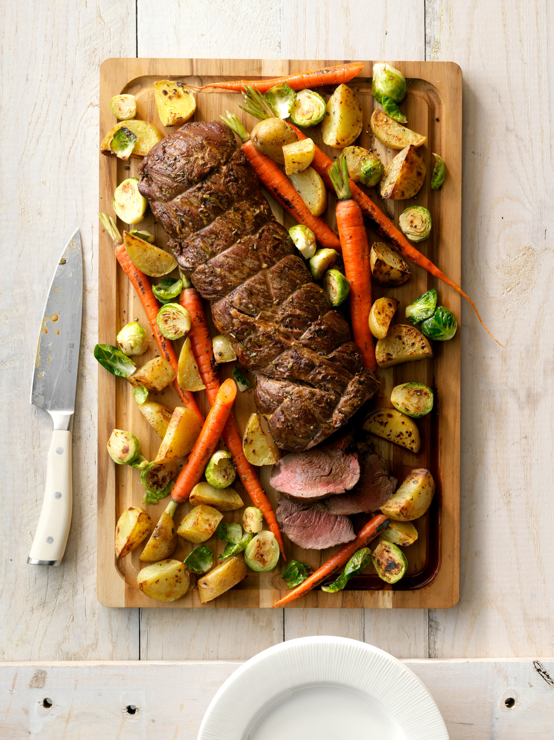 Beef Tenderloin with Roasted Vegetables photo by Chris Kessler Photography.  Chris Kessler is a freelance Photographer based in Milwaukee Wisconsin. Specializing in Food photography and portraiture.